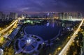 Buildings with reflections on lake at sunset at Thanh Xuan park. Royalty Free Stock Photo