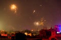 Buildings silhouetted against fireworks in Jaipur