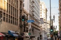 Buildings on the street in downtown Los Angeles with broadway sign on the traffic lights