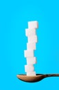 Buildings from sugar cubes and chocololate on a blue background Royalty Free Stock Photo