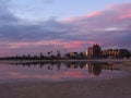 Buildings and sunset reflected in water Royalty Free Stock Photo