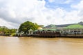 buildings and trees along Sungai Temburong river in the Temburong District in Brunei Darussalam Royalty Free Stock Photo