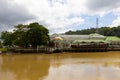 buildings and trees along Sungai Temburong river in the Temburong District in Brunei Darussalam Royalty Free Stock Photo