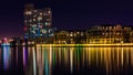 Buildings on the waterfront at night in the Inner Harbor, Baltimore, Maryland.