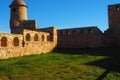 Built in light brown stone, circular shape, on the left the romanic church, benabarre,