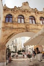 built passage between two buildings, portico between two streets, town of Locorotondo, Puglia, tourist town, historic buildings