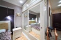 Built-in white wardrobe with mirrored doors in bedroom