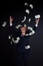 Buisnessman and falling down money Royalty Free Stock Photo