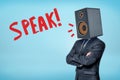 A buisnessman in a suit, with a big acoustic speaker instead of his head and the title `Speak` on a blue backround.