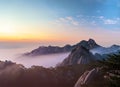 bukhansan mountains is covered by morning fog and sunrise. Generative AI Royalty Free Stock Photo