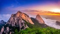 Bukhansan mountains is covered by morning fog and sunrise. Royalty Free Stock Photo