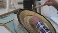 Bukhara master engraves patterns on a tray.