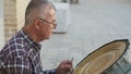 Bukhara master engraves patterns on a tray.