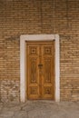Bukhara, Uzbekistan. December 2022. Carved doors with lock