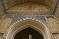 Bukhara, Uzbekistan. December 2022. A portal made of mosaic and Arabic script to the Kalyan Mosque