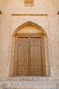 Bukhara, Uzbekistan. March 2022. Carved wooden door in oriental motifs