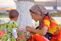 A colorful portrait of a Uzbek young woman with her little daughter