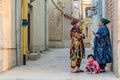 BUKHARA, UZBEKISTAN - MAY 1, 2018: Local women chat in the center of Bukhara, Uzbekist