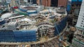 View from above, top down aerial view of a construction site with cranes in Kuala Lumpur, Malaysia