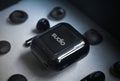 Closeup shot of black Sudio Nio earphones in a case Royalty Free Stock Photo