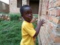 Young boy looks up, Kampala, Uganda