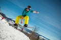 Bukovel, Ukraine - December 22, 2016: Man boarder jumping on his snowboard against the backdrop of mountains, hills and Royalty Free Stock Photo