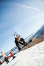 Bukovel, Ukraine - December 22, 2016: Man boarder jumping on his snowboard against the backdrop of mountains, hills and Royalty Free Stock Photo