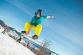 Bukovel, Ukraine - December 22, 2016: Man boarder jumping on his snowboard against the backdrop of mountains, hills and Royalty Free Stock Photo