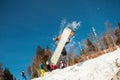 Bukovel, Ukraine - December 22, 2016: Man boarder jumping on his snowboard against the backdrop of mountains, hills and Royalty Free Stock Photo