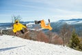 Bukovel, Ukraine - December 22, 2016: Men boarders jumping on his snowboard against the backdrop of mountains, hills and