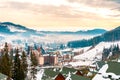 Bukovel Ukraine February 3 2019: Hotel complexes on the background of picturesque winter Carpathians tourists in Bukovel