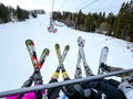 Bukovel Ukraine - February 2022 Ski set on ski lift. Group of friends Professional skiing with poles Winter sport