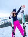 Bukovel Ukraine - February 2022 Skier woman on the ski slope resting relaxing extreme recreation active lifestyle Royalty Free Stock Photo