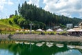 Bukovel. Ukraine. 17. July. 2021. Beautiful fish restaurant by the lake, in a ski resort. Carpathians. Summer rest Royalty Free Stock Photo