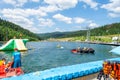 Bukovel. Ukraine. 17. July. 2021. Lake of Youth. People are resting and having fun at water attractions. Carpathians. Summer Royalty Free Stock Photo