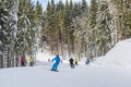 2016-12-17 Bukovel, Ukraine. Snowboarders and skiers on the slopes of Bukivel Ski resort