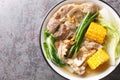 Bulalo is a Filipino boiled soup made with bone-in beef shanks, corn and cabbage leaves closeup in the bowl. Horizontal top view Royalty Free Stock Photo