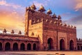 Buland Darwaza medieval stone gateway at Fatehpur Sikri Agra at sunset with moody sky.