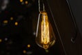 Bulb. Edison lamp. Wooden table lamp. In the dark Royalty Free Stock Photo