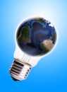Bulb with globe blue gradient background,Earth Map and Globe shape courtesy of NASA. Royalty Free Stock Photo