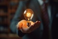 a bulb in hand of businessman, creative concept, light bulb with hand, AI generated