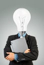 Bulb headed man and laptop Royalty Free Stock Photo