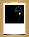 Bulb idea photo paper on board background Royalty Free Stock Photo