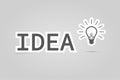 Bulb light, idea text in flat design on a grey colored Royalty Free Stock Photo