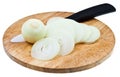 Bulb and sliced onions with ceramic knife on board