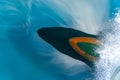 Bulbous bow of the warship sailing through the sea created wave piercing water splash with reflection of its hull and cloud above Royalty Free Stock Photo