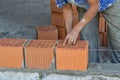Bulder worker laying hollow clay block 2