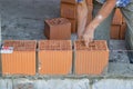 Bulder worker laying hollow clay block