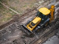 Bulldoze Making and constructing a new asphalt road near the civil building. Concepts of improvement of the territory of buildings