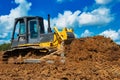Buldozer moving earth. Road construction building work Royalty Free Stock Photo